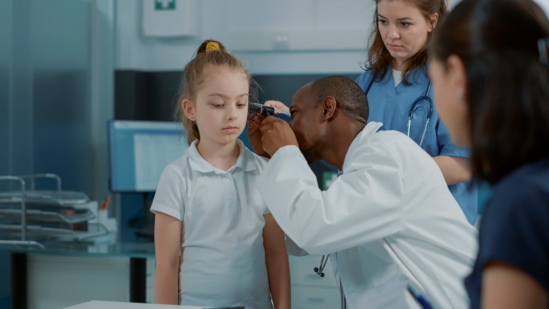 Doctor checking for ear infection